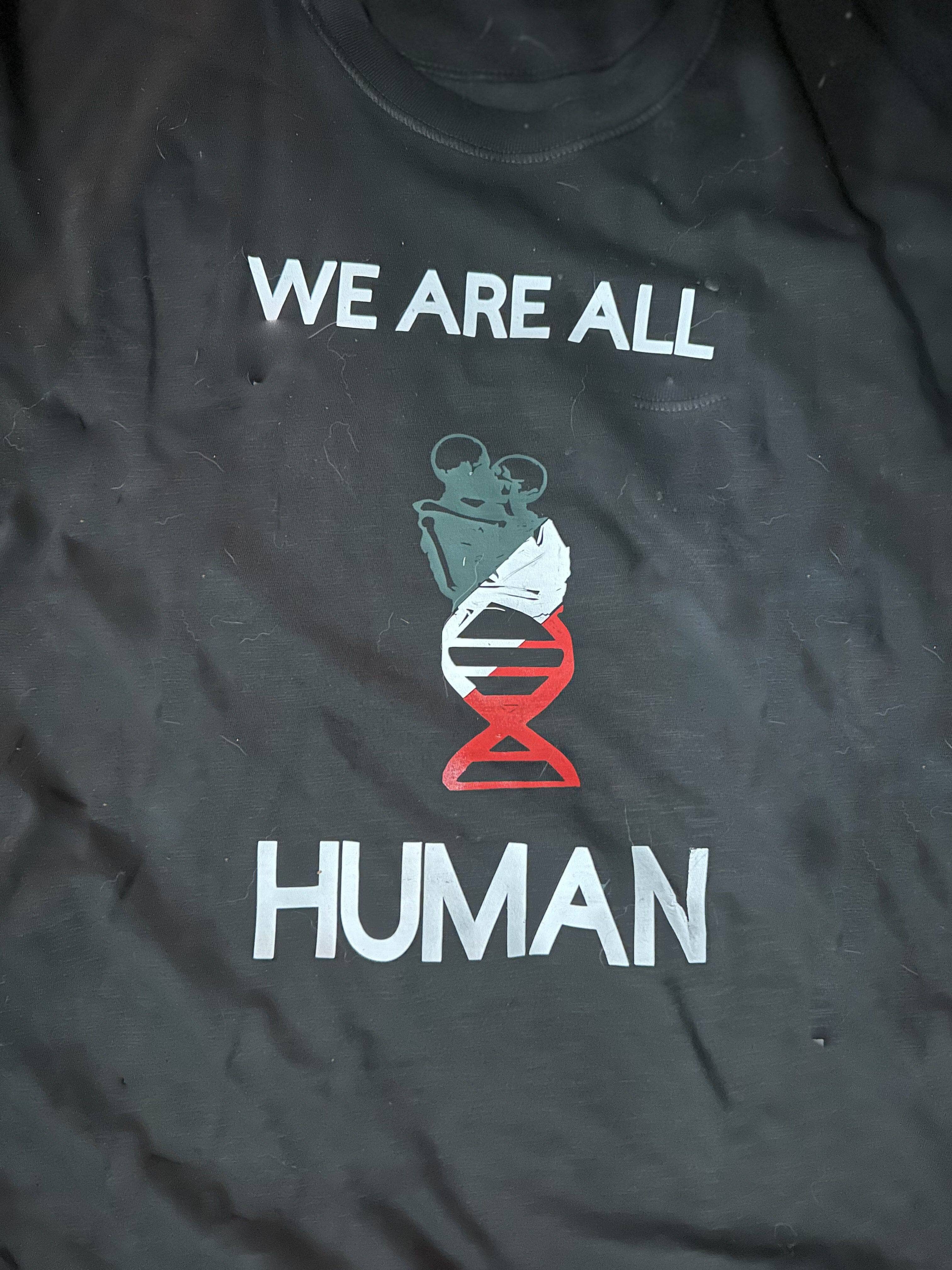 WE ARE ALL HUMAN in solidarity with the civilians of Palestine Statement Tee - Sheehan and Co.